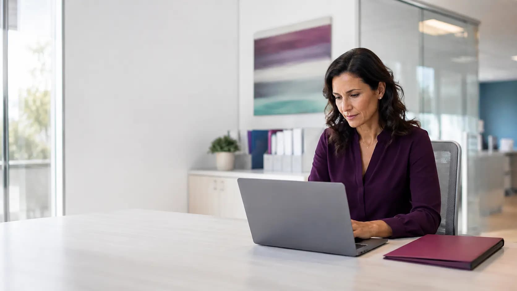 Healthcare practice administrator reviewing operations in a bright clinic office